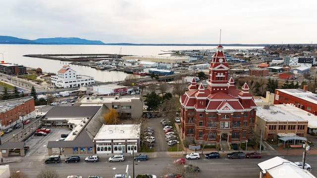 bird's eye view with a water and mountain view