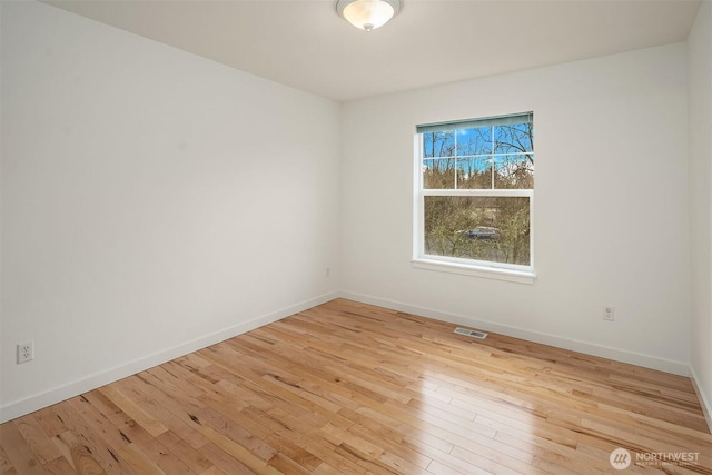 unfurnished room featuring light wood-type flooring