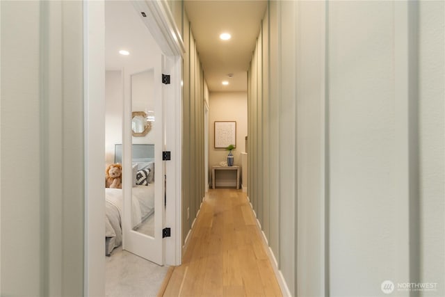 corridor with recessed lighting and light wood-style flooring