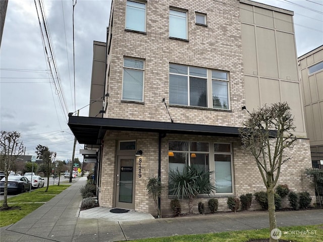 view of front of house featuring brick siding