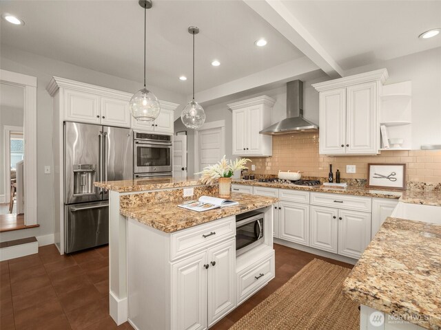 kitchen with open shelves, wall chimney range hood, appliances with stainless steel finishes, and white cabinets