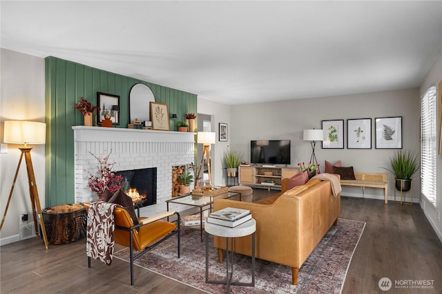 living room featuring a fireplace and dark hardwood / wood-style flooring