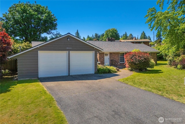 10444 16th Ave S, Seattle, WA 98168 - ranch-style house featuring a front lawn, a garage, driveway, a chimney, and brick siding