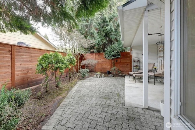 view of patio / terrace with outdoor dining space and a fenced backyard