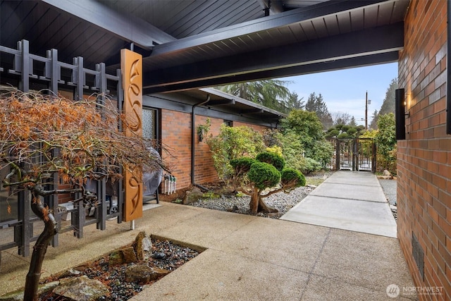 view of patio / terrace featuring a gate and fence