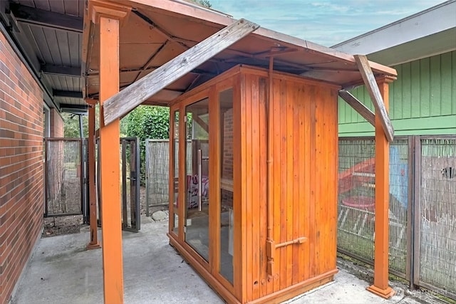 view of outbuilding with an outdoor structure and fence