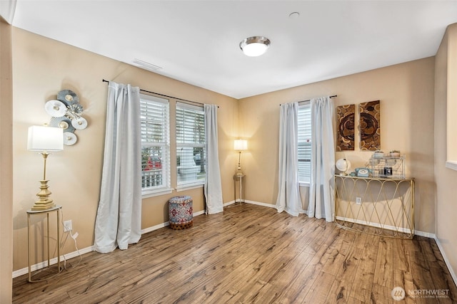 spare room with wood-type flooring