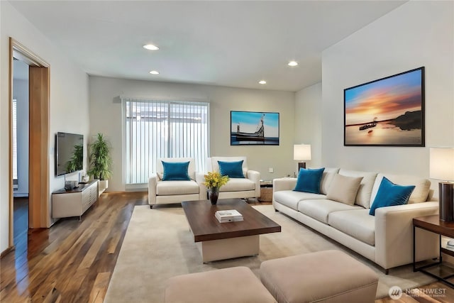 living area with recessed lighting and wood finished floors