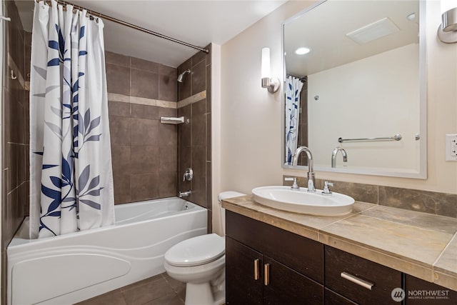 full bathroom with vanity, tile patterned flooring, toilet, and shower / tub combo