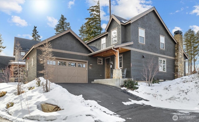 view of front of home with a garage and driveway