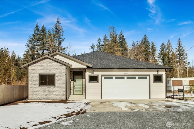 ranch-style home featuring a garage