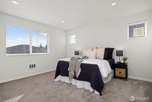 bedroom featuring light carpet, baseboards, visible vents, and recessed lighting