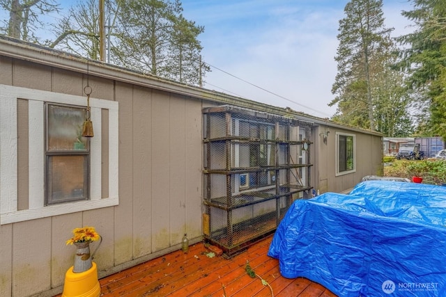 view of property exterior with a deck