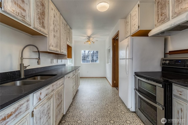 kitchen featuring light floors, white dishwasher, a sink, double oven range, and under cabinet range hood