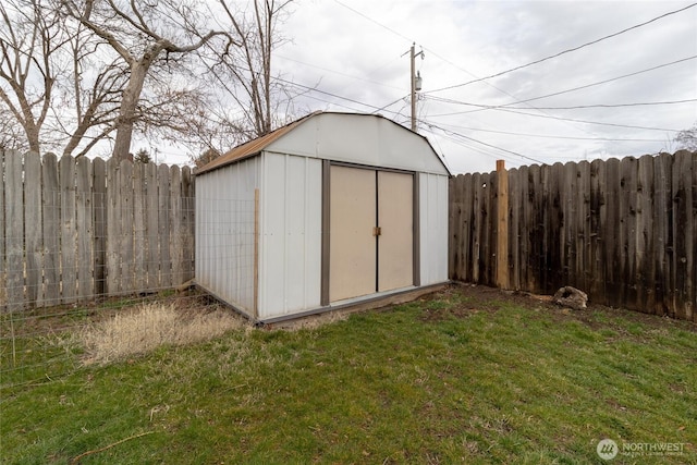 view of shed with a fenced backyard