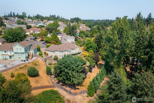 birds eye view of property with a residential view