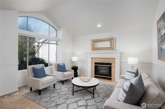 carpeted living room with lofted ceiling, visible vents, recessed lighting, and a tile fireplace