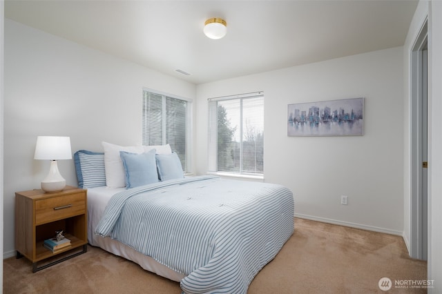 bedroom with carpet flooring, visible vents, and baseboards