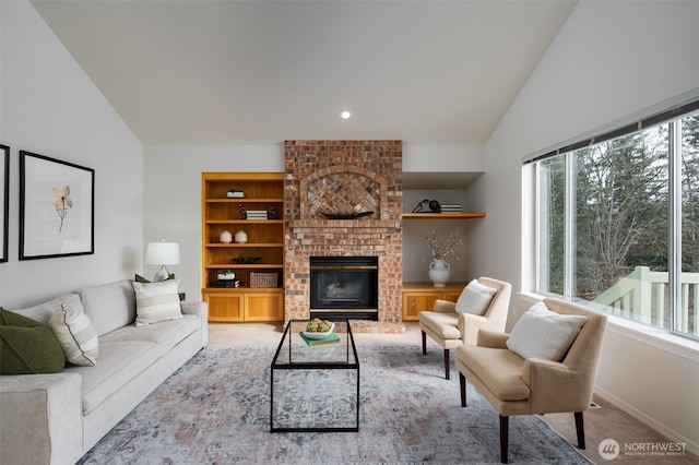 living area featuring light carpet, baseboards, lofted ceiling, built in shelves, and a fireplace