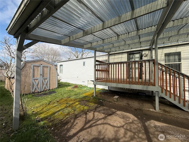 exterior space featuring an outbuilding, a shed, and a deck