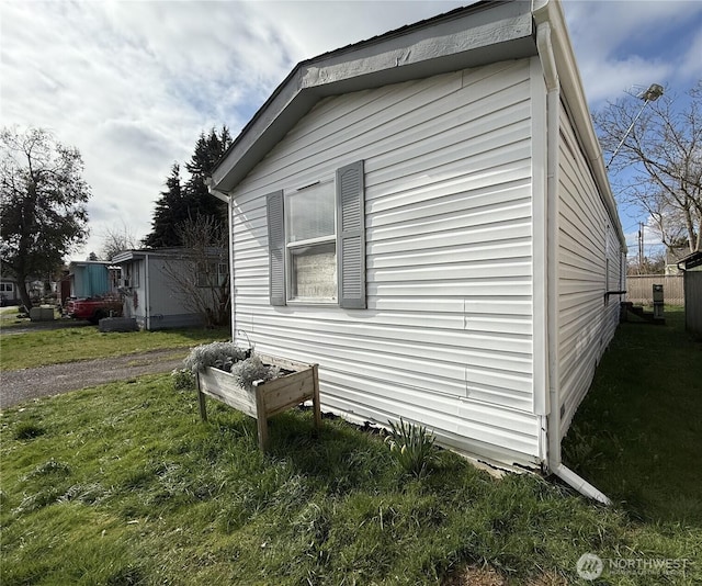 view of property exterior featuring a yard