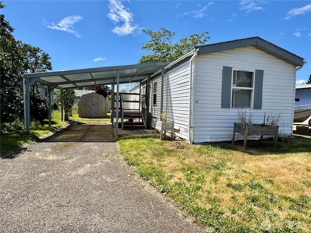 3700 X St Unit 80, Vancouver, WA 98663 - view of front of house with driveway, a carport, and a front yard
