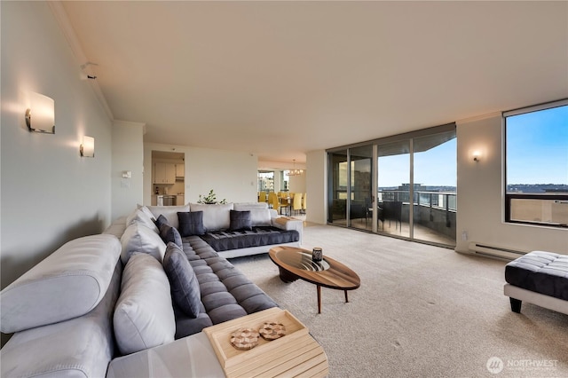 carpeted living room with a baseboard heating unit and crown molding