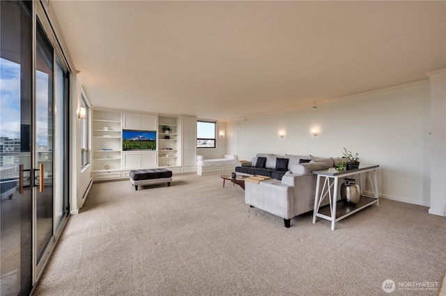 living area with a baseboard radiator, light carpet, and baseboards