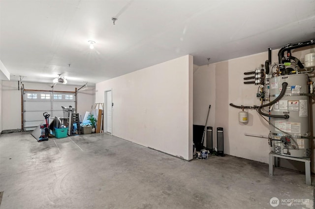 garage featuring water heater and a garage door opener