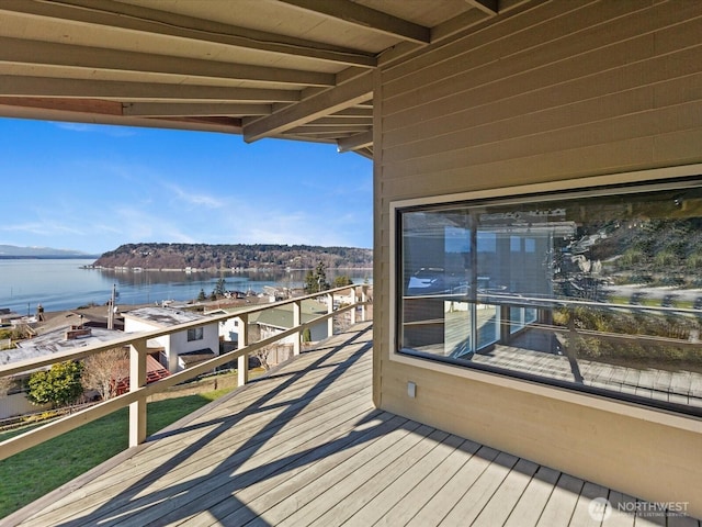 wooden deck with a water view