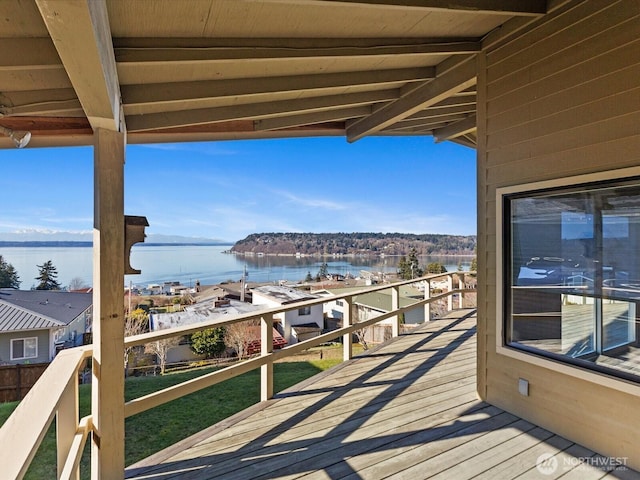 wooden deck with a water view