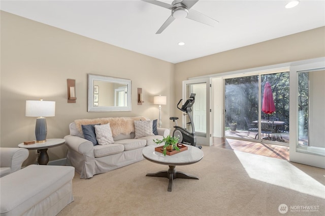 living area featuring carpet floors, ceiling fan, and recessed lighting