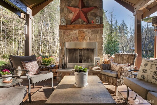 view of patio / terrace featuring an outdoor living space with a fireplace