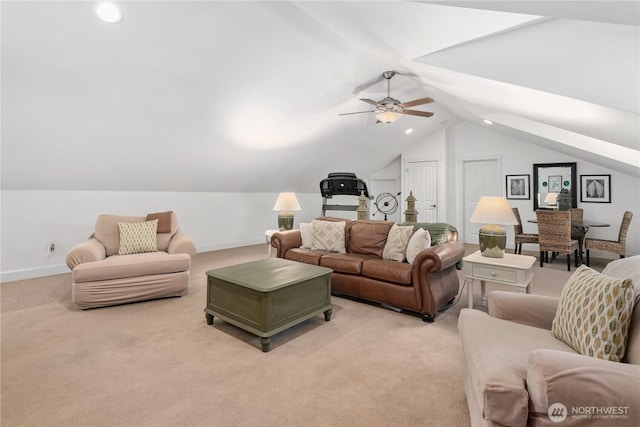 living area featuring lofted ceiling, light carpet, and baseboards