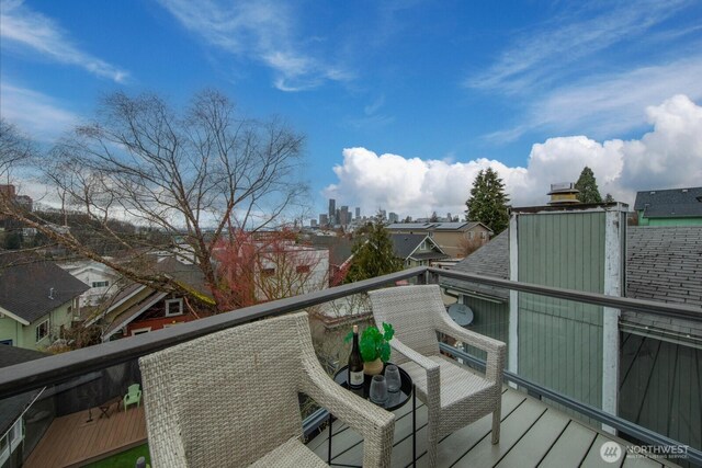 wooden deck with a city view