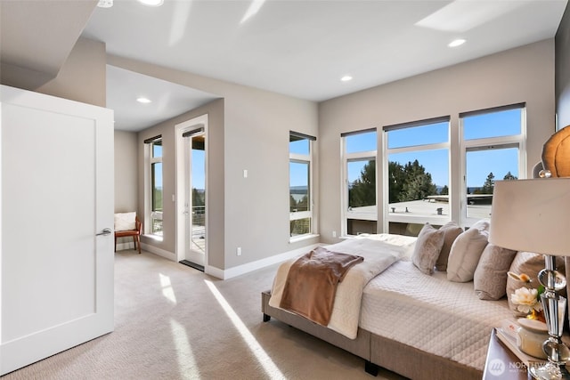 bedroom featuring recessed lighting, access to outside, baseboards, and light colored carpet