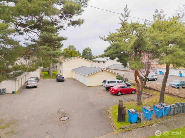 view of front of house featuring fence
