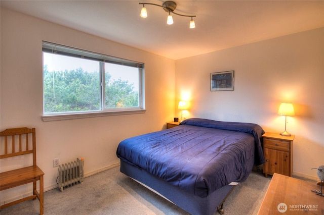 carpeted bedroom with radiator