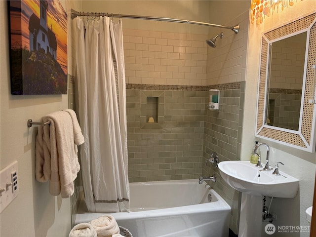 full bathroom featuring shower / bath combo and a sink