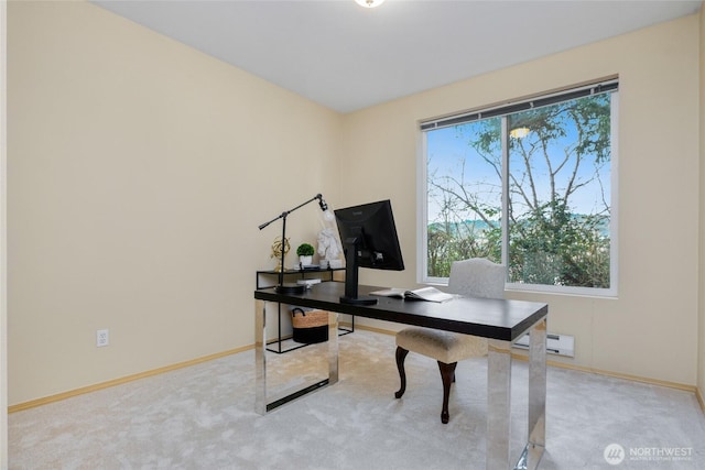 carpeted home office featuring baseboards and a baseboard radiator