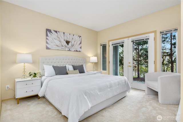 bedroom featuring light colored carpet and access to outside