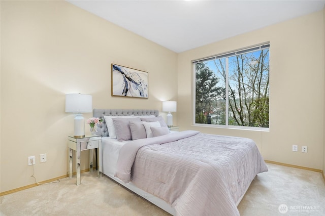 carpeted bedroom featuring baseboards