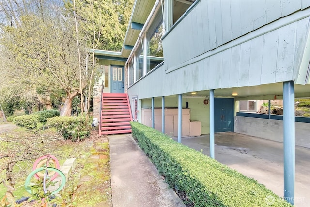 entrance to property with a carport