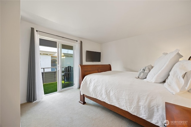 bedroom with light carpet and access to outside