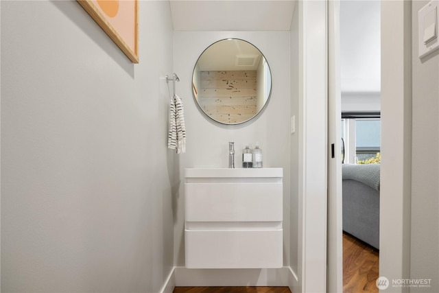 bathroom featuring visible vents and wood finished floors