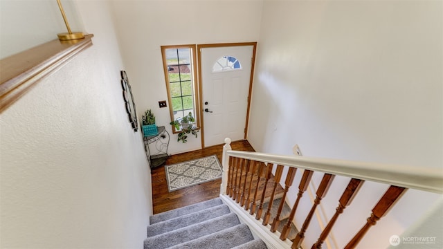 foyer with stairs and wood finished floors