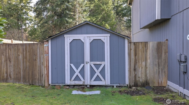 view of shed with fence