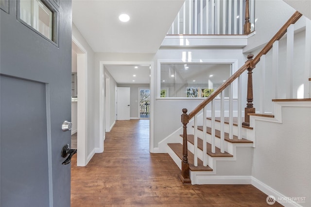 entrance foyer featuring stairway, recessed lighting, wood finished floors, and baseboards