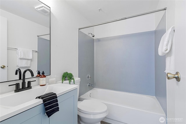 bathroom featuring toilet, bathing tub / shower combination, visible vents, and vanity