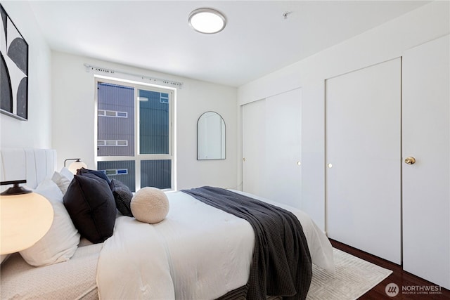 bedroom featuring dark wood-style floors